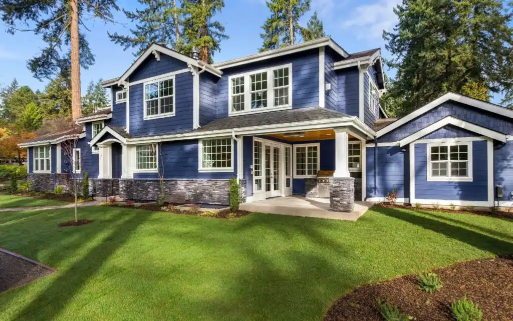 Custom home exterior in New Jersey with siding and stone